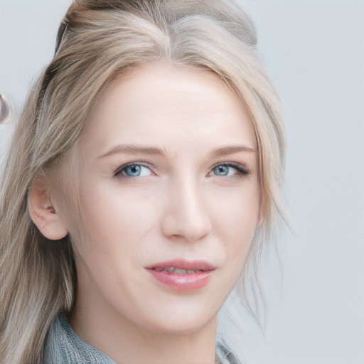 Joyful white young-adult female with medium  blond hair and blue eyes