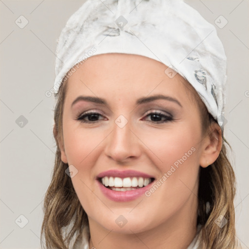 Joyful white young-adult female with long  brown hair and brown eyes