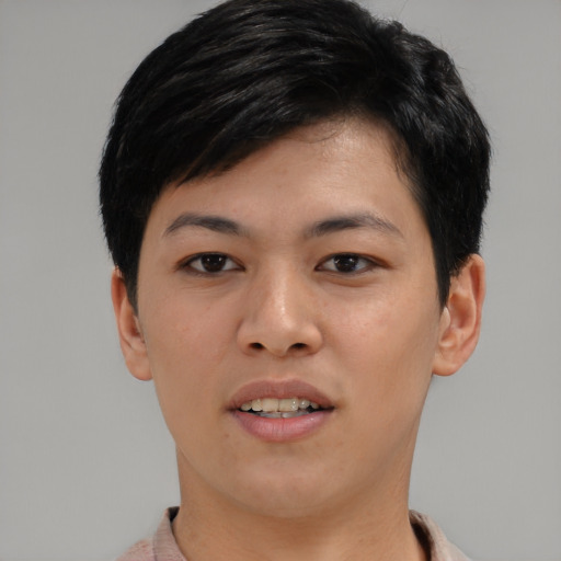 Joyful asian young-adult female with short  black hair and brown eyes