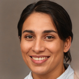 Joyful white adult female with medium  brown hair and brown eyes