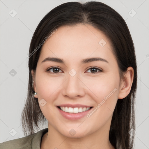 Joyful white young-adult female with long  brown hair and brown eyes