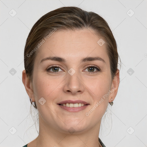 Joyful white young-adult female with medium  brown hair and grey eyes