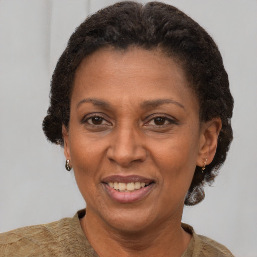 Joyful latino adult female with short  brown hair and brown eyes