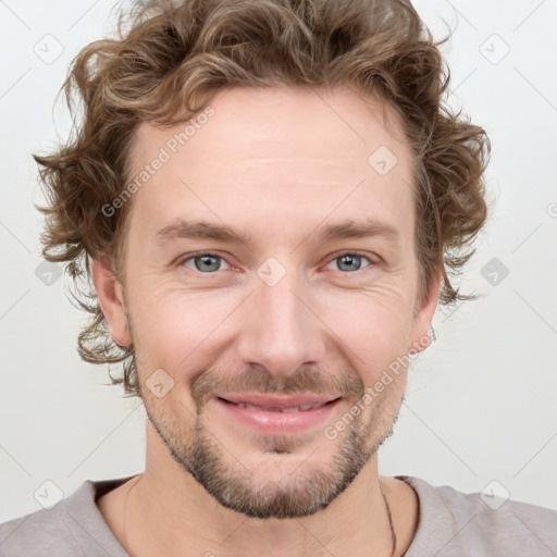 Joyful white young-adult male with short  brown hair and blue eyes