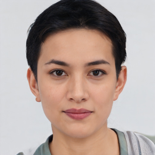 Joyful asian young-adult female with short  black hair and brown eyes