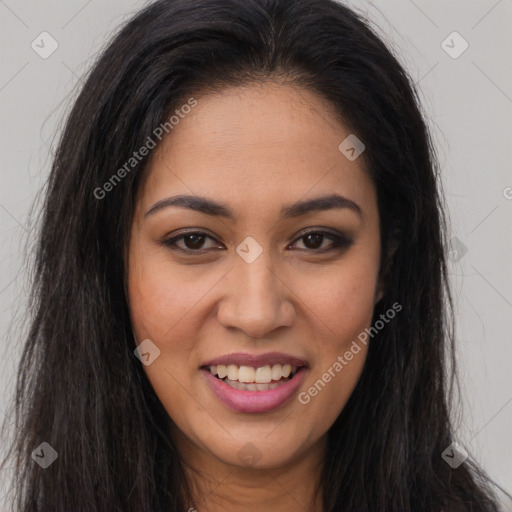 Joyful latino young-adult female with long  brown hair and brown eyes