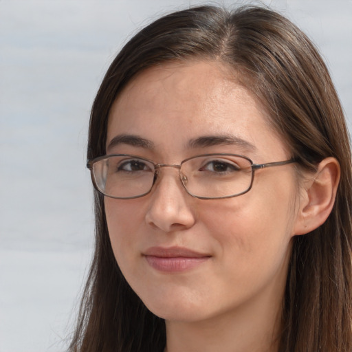 Joyful white adult female with long  brown hair and brown eyes