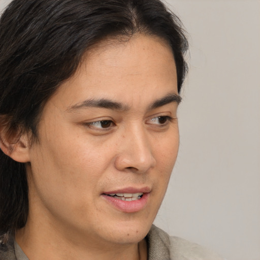 Joyful white adult male with medium  brown hair and brown eyes