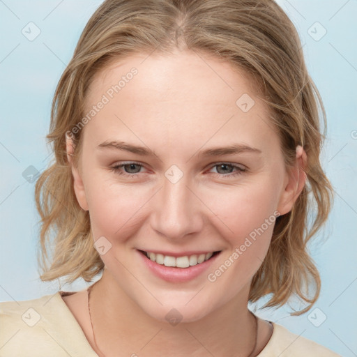 Joyful white young-adult female with medium  brown hair and blue eyes