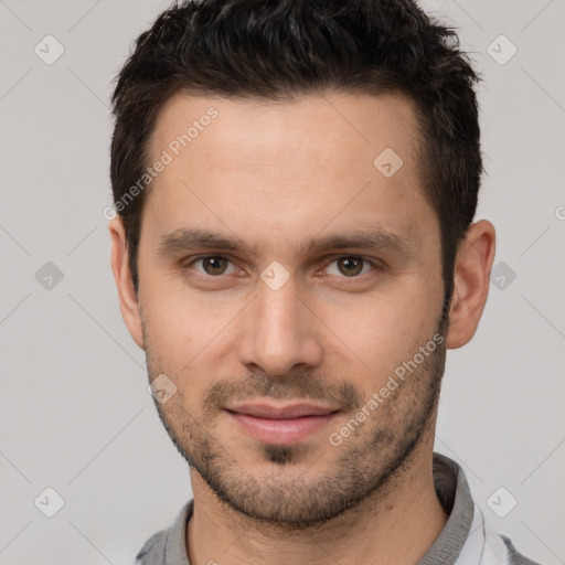 Joyful white young-adult male with short  brown hair and brown eyes