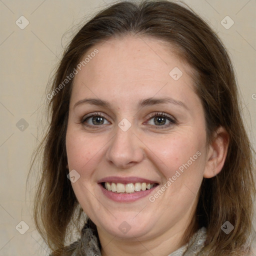 Joyful white adult female with medium  brown hair and grey eyes