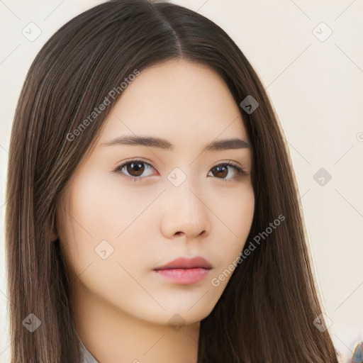 Neutral white young-adult female with long  brown hair and brown eyes