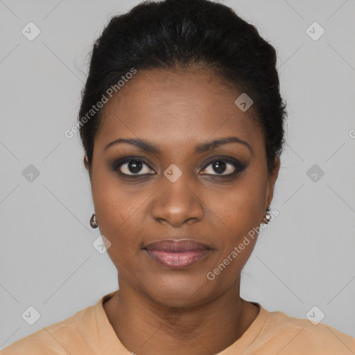 Joyful black young-adult female with short  black hair and brown eyes