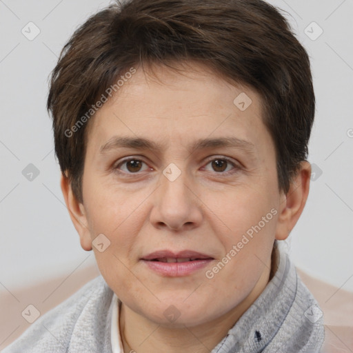 Joyful white adult female with short  brown hair and brown eyes