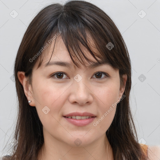 Joyful white adult female with long  brown hair and brown eyes