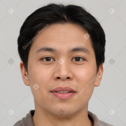 Joyful asian young-adult male with short  brown hair and brown eyes