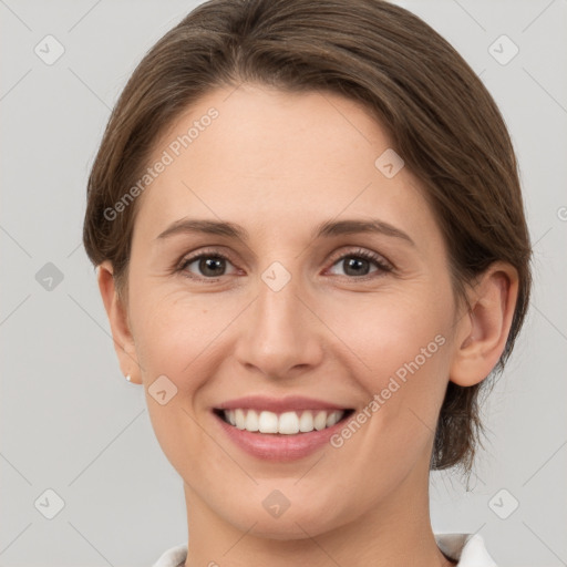 Joyful white young-adult female with medium  brown hair and grey eyes