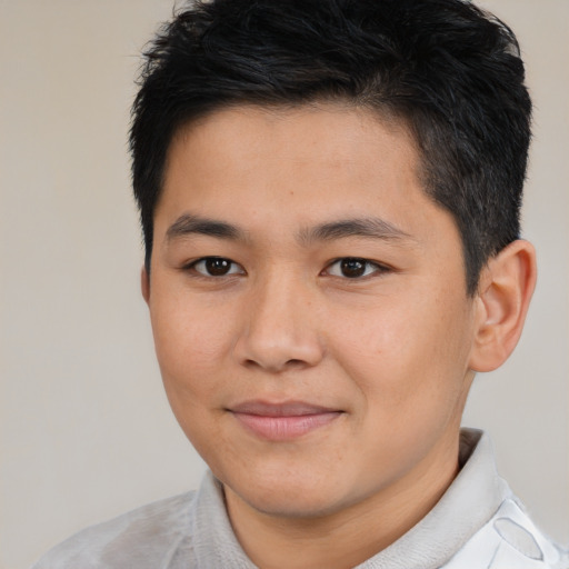 Joyful asian young-adult male with short  brown hair and brown eyes