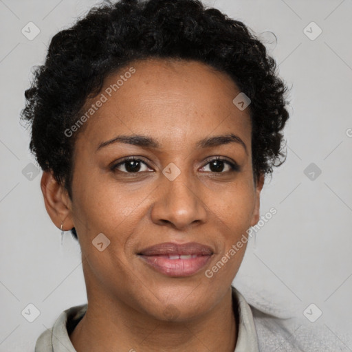 Joyful black adult female with short  brown hair and brown eyes