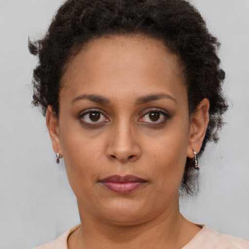 Neutral black young-adult female with short  brown hair and brown eyes