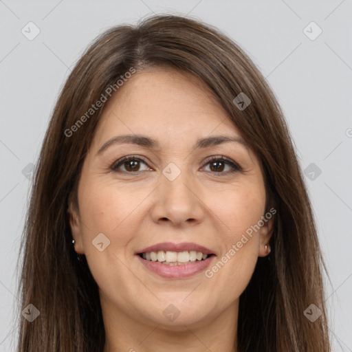 Joyful white adult female with long  brown hair and brown eyes