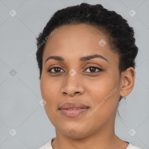 Joyful black young-adult female with short  brown hair and brown eyes