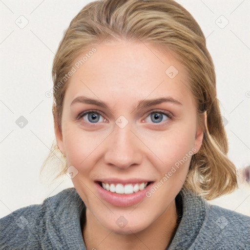 Joyful white young-adult female with medium  brown hair and blue eyes