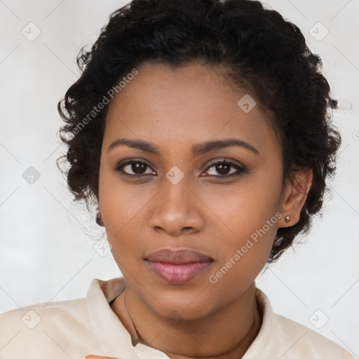 Joyful black young-adult female with long  brown hair and brown eyes