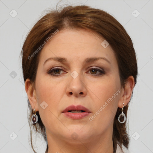 Joyful white adult female with medium  brown hair and grey eyes