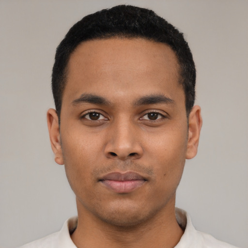 Neutral latino young-adult male with short  black hair and brown eyes