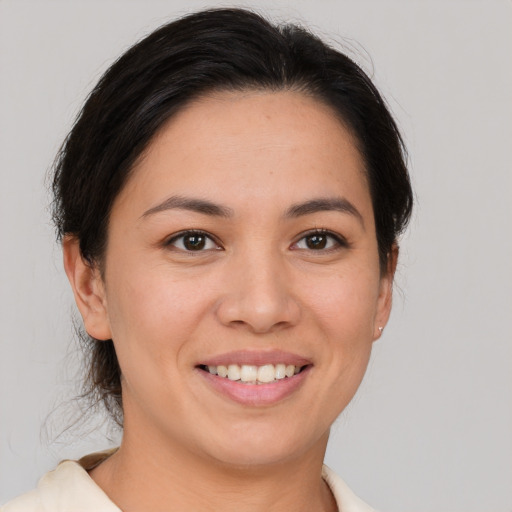 Joyful white young-adult female with short  brown hair and brown eyes