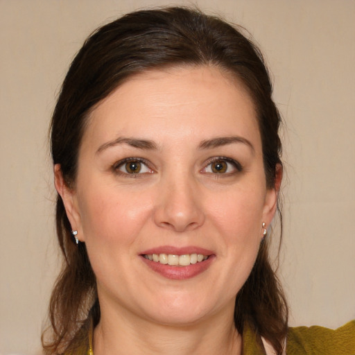 Joyful white young-adult female with medium  brown hair and brown eyes