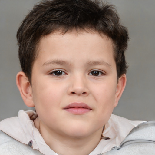 Joyful white child male with short  brown hair and brown eyes