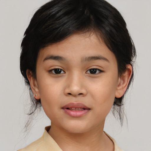 Joyful asian child female with medium  brown hair and brown eyes