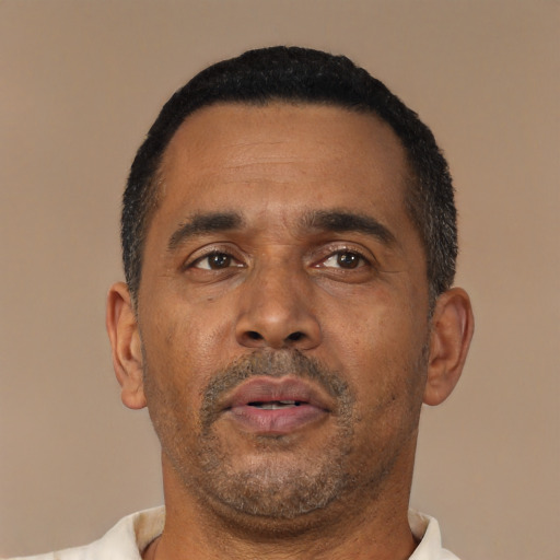 Neutral latino adult male with short  black hair and brown eyes