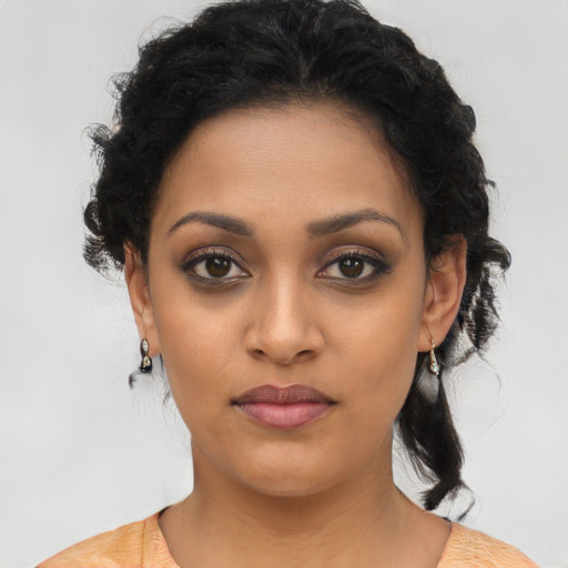 Joyful latino young-adult female with medium  black hair and brown eyes