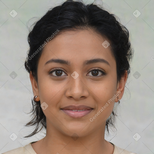 Joyful latino young-adult female with medium  brown hair and brown eyes