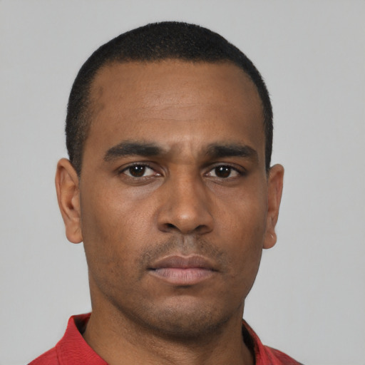 Neutral black young-adult male with short  black hair and brown eyes