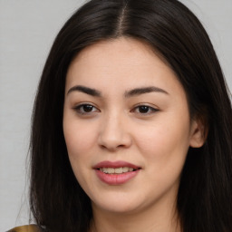 Joyful asian young-adult female with long  brown hair and brown eyes