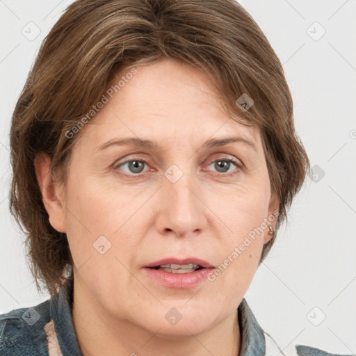 Joyful white adult female with medium  brown hair and grey eyes