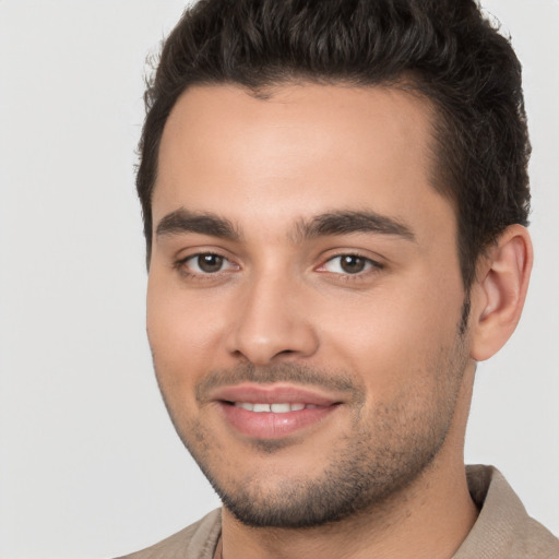 Joyful white young-adult male with short  brown hair and brown eyes