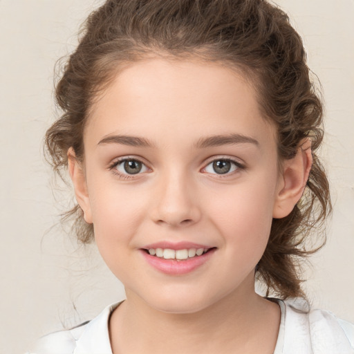 Joyful white child female with medium  brown hair and brown eyes