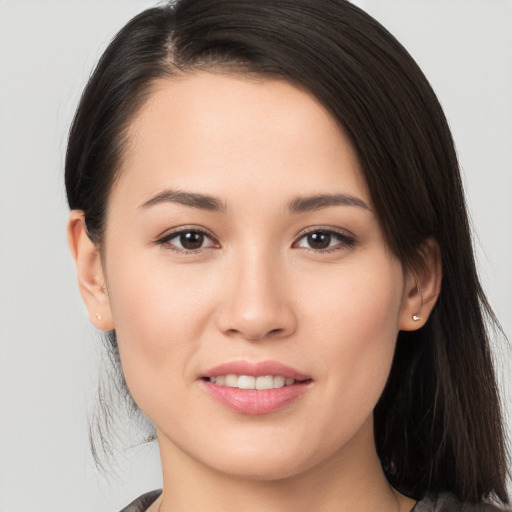 Joyful white young-adult female with long  brown hair and brown eyes