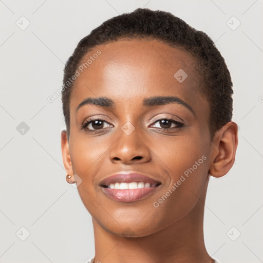 Joyful black young-adult female with short  brown hair and brown eyes