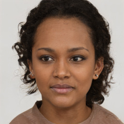 Neutral black young-adult female with long  brown hair and brown eyes