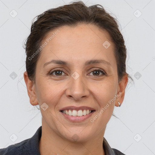 Joyful white adult female with short  brown hair and brown eyes