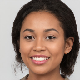 Joyful white young-adult female with medium  brown hair and brown eyes