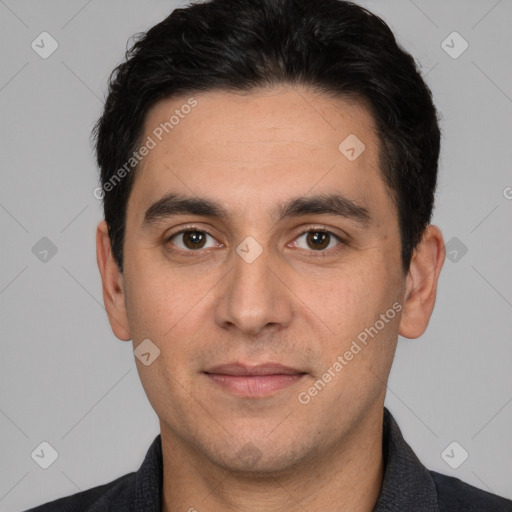 Joyful white young-adult male with short  black hair and brown eyes