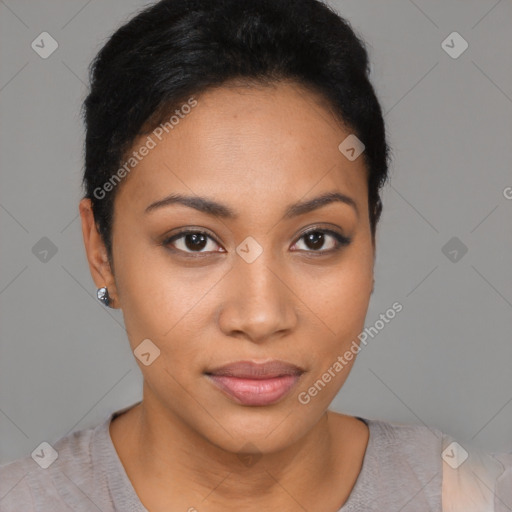 Joyful latino young-adult female with short  black hair and brown eyes