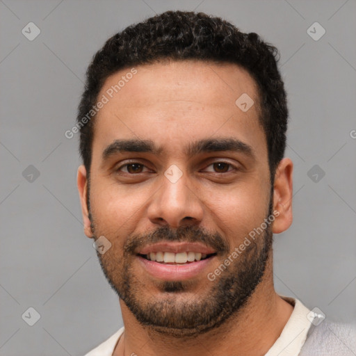 Joyful white young-adult male with short  black hair and brown eyes